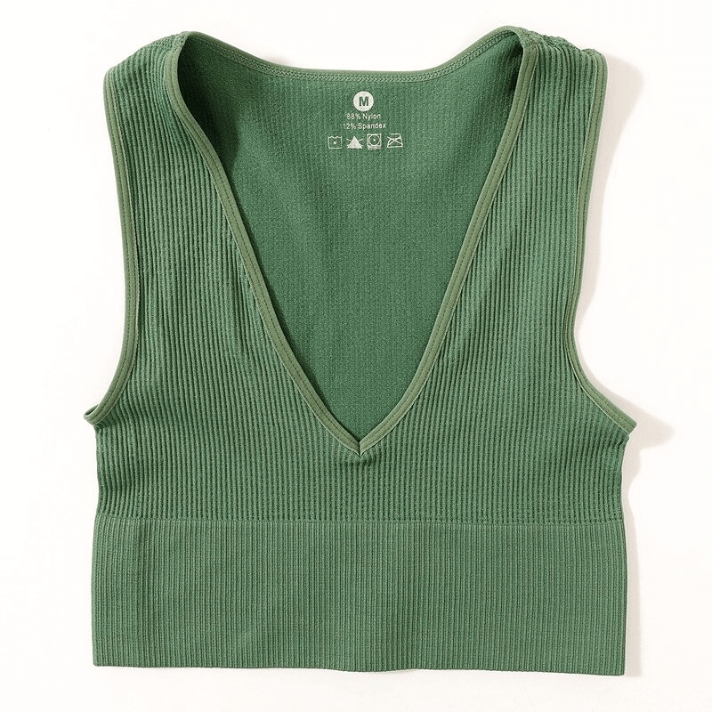 Green ribbed seamless tank top with deep V-neck, perfect for yoga and sports activities, made of polyester and spandex for comfort.